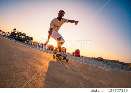 Surf skater training surfing moves 127737359