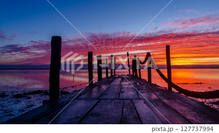 Sunrise of a wooden pier Sunrise of a wooden pier 127737994