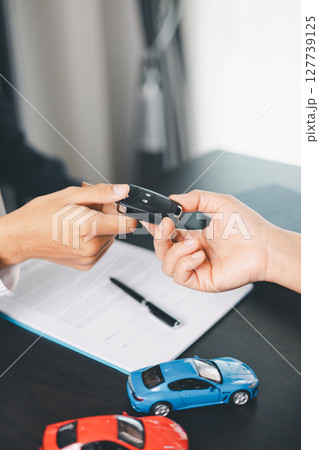 Concept business vehicle finance protection office plan investment buy sell car ensuring idea financial security. automobile agent hand protect purchase insurance and secure favorable loan deal. 127739125