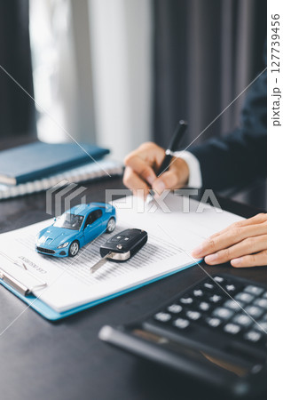 Concept business vehicle finance protection office plan investment buy sell car ensuring idea financial security. automobile agent hand protect purchase insurance and secure favorable loan deal. Concept business vehicle finance protection office plan investment buy sell car ensuring idea financial security. automobile agent hand protect purchase insurance and secure favorable loan deal. 127739456
