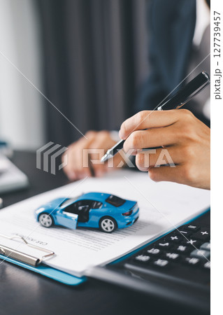 Concept business vehicle finance protection office plan investment buy sell car ensuring idea financial security. automobile agent hand protect purchase insurance and secure favorable loan deal. 127739457