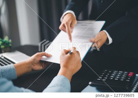 Business people signing contract making deal with life insurance agent Concept for consultant health insurance life insurance savings plan. Approved stamp with Business people contract making deal Business people signing contract making deal with life insurance agent Concept for consultant health insurance life insurance savings plan. Approved stamp with Business people contract making deal 127739605