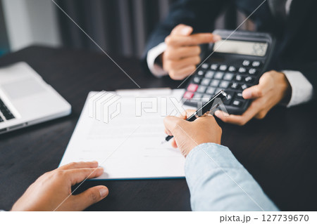 Business people signing contract making deal with life insurance agent Concept for consultant health insurance life insurance savings plan. Approved stamp with Business people contract making deal Business people signing contract making deal with life insurance agent Concept for consultant health insurance life insurance savings plan. Approved stamp with Business people contract making deal 127739670
