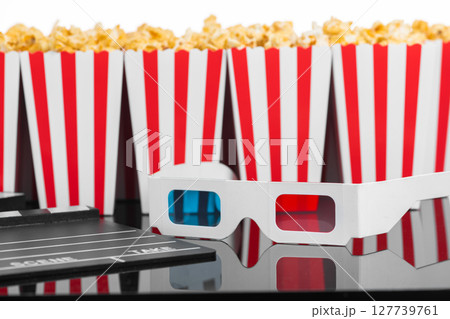 Popcorn boxes with 3D glasses and clapperboard 127739761