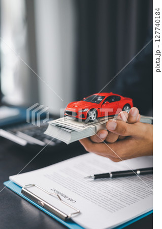 Concept business vehicle finance protection office plan investment buy sell car ensuring idea financial security. automobile agent hand protect purchase insurance and secure favorable loan deal. 127740184