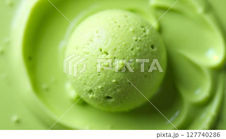 A close-up shot of a creamy ice cream scoop, displaying its silky texture and deep colors 127740286