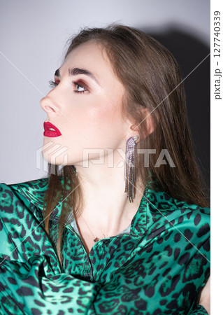 Beautiful woman with make-up profile studio portrait 127740339
