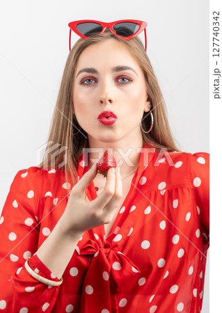 Retro style woman portrait with strawberry 127740342