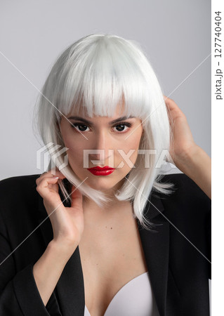 Beautiful woman with black eyes and white wig portrait 127740404