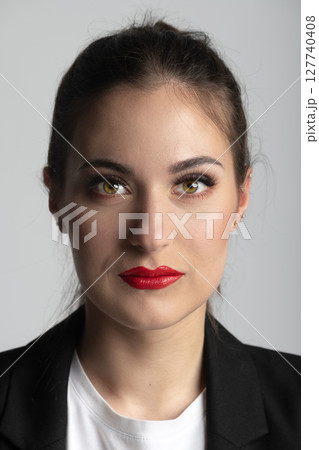Close-up beautiful woman studio portrait in grey background 127740408
