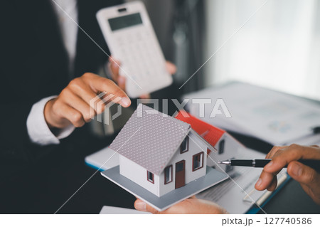 Concept business house finance protection office plan investment buy sell home ensuring idea financial security. residence agent hand protect purchase insurance and secure favorable loan deal. 127740586