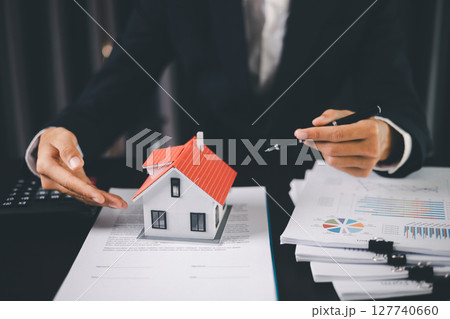 Concept business house finance protection office plan investment buy sell home ensuring idea financial security. residence agent hand protect purchase insurance and secure favorable loan deal. 127740660