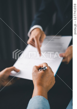 Business people signing contract making deal with life insurance agent Concept for consultant health insurance life insurance savings plan. Approved stamp with Business people contract making deal 127741059