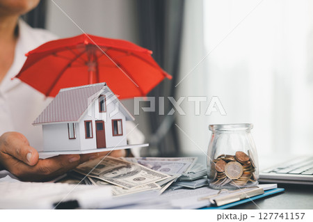 Concept business house finance protection office plan investment buy sell home ensuring idea financial security. residence agent hand protect purchase insurance and secure favorable loan deal. 127741157