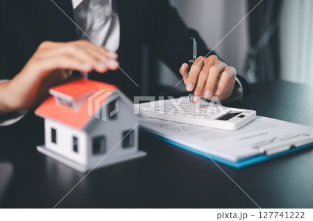 Concept business house finance protection office plan investment buy sell home ensuring idea financial security. residence agent hand protect purchase insurance and secure favorable loan deal. 127741222