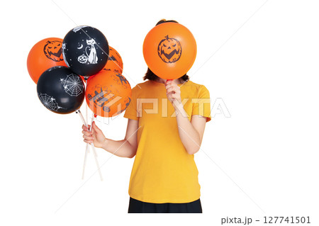 Person playfully holds Halloween balloons, isolated on white, PNG 127741501