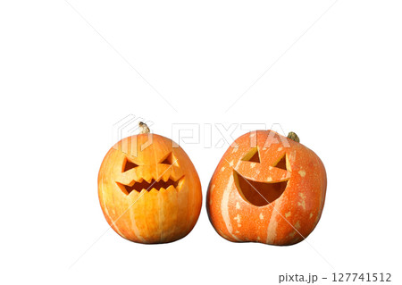 Carved pumpkins with playful and spooky faces, isolated on white, PNG 127741512