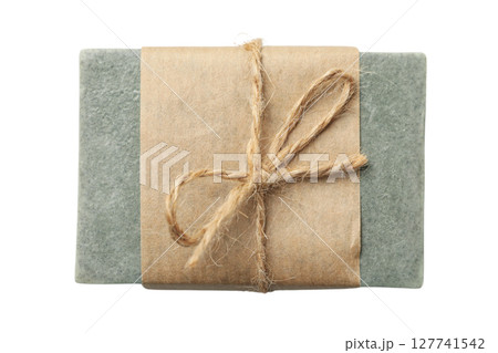 Elegant handmade soap in brown paper, isolated on white, PNG 127741542