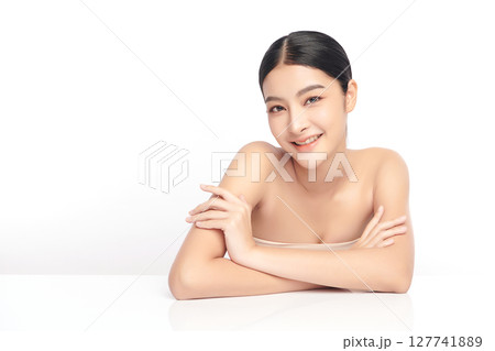 A beautiful young Asian woman with clean, fresh skin against a white background. Skincare, facial treatment, cosmetology, beauty, and spa. An elegant portrait of an Asian woman. A beautiful young Asian woman with clean, fresh skin against a white background. Skincare, facial treatment, cosmetology, beauty, and spa. An elegant portrait of an Asian woman. 127741889
