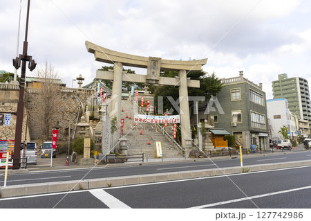 Shimonoseki, JAPAN - Dec 29,2022 : View of Kameyama Hachimangu shrine in Shimonoseki, Japan on Dec 29,2022. Shimonoseki, JAPAN - Dec 29,2022 : View of Kameyama Hachimangu shrine in Shimonoseki, Japan on Dec 29,2022. 127742986