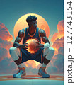 A basketball player in a powerful stance, holding a glowing basketball surrounded by flames, with a dramatic red moon in the background. Motivational concept for basketball enthusiasts. 127743154