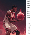 A basketball player in a powerful stance, holding a glowing basketball surrounded by flames, with a dramatic red moon in the background. Motivational concept for basketball enthusiasts. 127743156