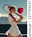 A female tennis player in her athletic outfit, focused on the red moon above as she prepares for a serve, with a clear blue sky and a tennis court in the background. Motivational concept for tennis 127743247