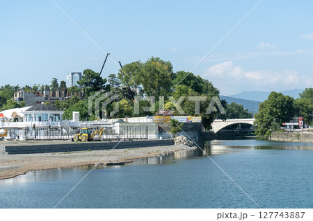 Water canal leading to the sea with a bridge. Water canal leading to the sea with a bridge. 127743887