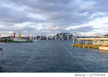 Kitakyushu, Japan - Dec 29,2022 : Cargo ship docking at Mojiko port in Kitakyushu, Japan on Dec 29,2022. 127745369