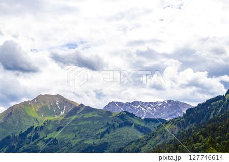 Tyrol Austria alpine mountain and hill landscape panorama cloudy sky. 127746614