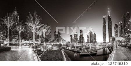 Skyscrapers and Urban city skyline over water, black and white style, city background, Dubai Marina bay UAE 127746810
