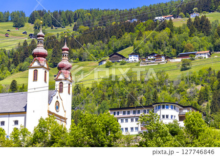Barbara church cathedral Barbarakirche Fliess with blue sky Tyrol Austria. Barbara church cathedral Barbarakirche Fliess with blue sky Tyrol Austria. 127746846