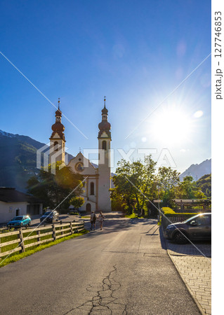 Barbara church cathedral Barbarakirche Fliess with blue sky Tyrol Austria. Barbara church cathedral Barbarakirche Fliess with blue sky Tyrol Austria. 127746853