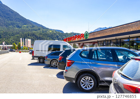 Interspar Supermarket parking lot with parked cars in Tyrol Austria. 127746855
