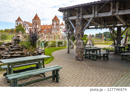 Mir Castle majestic fortification fortress Park cafe restaurant benches Belarus. Mir Castle majestic fortification fortress Park cafe restaurant benches Belarus. 127746874