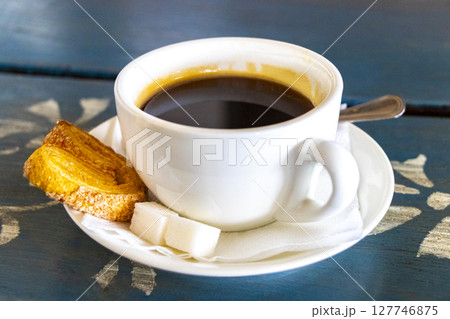 Fine Cup of Coffee on Wooden Table with Cookie Belarus. 127746875
