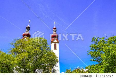 Barbara church cathedral Barbarakirche Fliess with blue sky Tyrol Austria. Barbara church cathedral Barbarakirche Fliess with blue sky Tyrol Austria. 127747257
