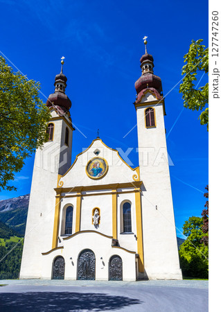 Barbara church cathedral Barbarakirche Fliess with blue sky Tyrol Austria. 127747260