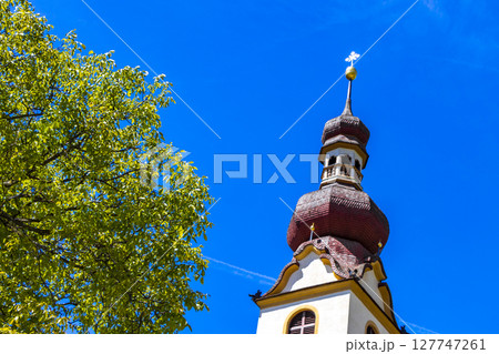 Barbara church cathedral with dome tower blue sky Tyrol Austria. 127747261
