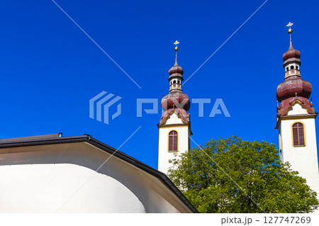 Barbara church cathedral Barbarakirche Fliess with blue sky Tyrol Austria. Barbara church cathedral Barbarakirche Fliess with blue sky Tyrol Austria. 127747269