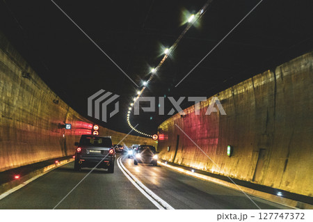 Driving through a tunnel in the mountains in Vorarlberg Austria. Driving through a tunnel in the mountains in Vorarlberg Austria. 127747372