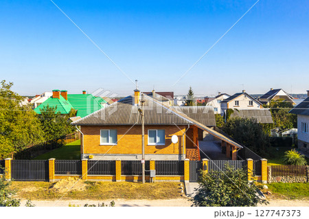 Brest Belarus colorful village streets with wooden huts brick houses . Brest Belarus colorful village streets with wooden huts brick houses . 127747373