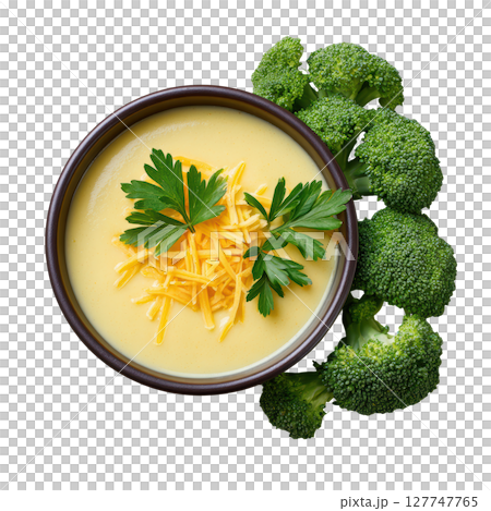 Creamy Broccoli Cheese Soup in a Bowl Garnished with Fresh Parsley and Surrounded by Broccoli Florets 127747765