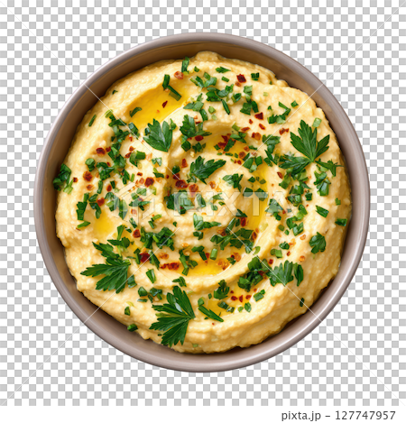 Fresh and Creamy Hummus Dip with Olive Oil and Herbs Served in a Decorative Bowl 127747957