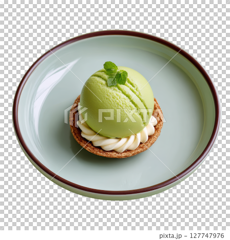 Delicious Matcha Dessert with Creamy Topping in Elegant Plating on a Soft Green Plate 127747976