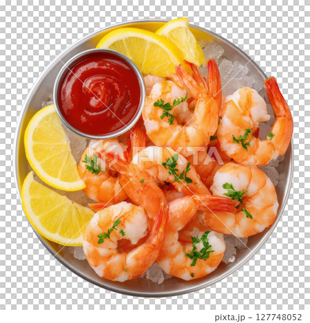 Fresh Shrimp Cocktail Served on Ice with Lemon Wedges and Tomato Sauce Garnish for Gourmet Dining Experience 127748052