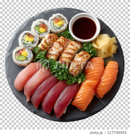Exquisite Sushi Platter with Assorted Fish, Rolls, Sauce, and Garnish on Slate Serving Board 127748085