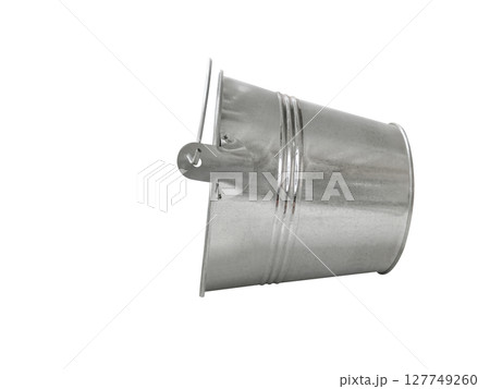 Silver iron bucket turned on its side on a white background. 127749260
