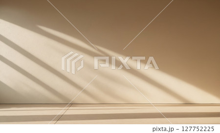 minimalistic background with blurred foliage shadow on beige wall minimalistic background with blurred foliage shadow on beige wall 127752225