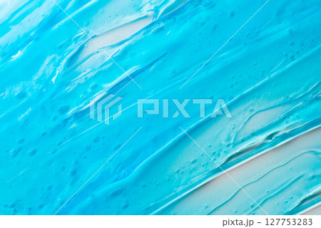 The texture of a blue cosmetic gel on a white background 127753283